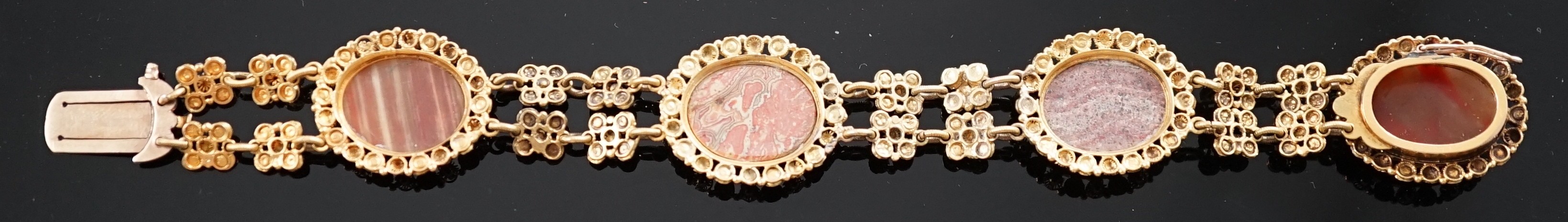 An early 19th century gold and four stone oval cabochon hardstone set bracelet